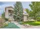 Inviting two-story home with a well-manicured lawn and attractive landscaping at 6598 S Telluride St, Aurora, CO 80016