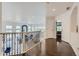 Spacious upper hallway overlooks the living area with hardwood floors at 6598 S Telluride St, Aurora, CO 80016