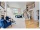 Spacious living room with a grand staircase and large windows at 6598 S Telluride St, Aurora, CO 80016