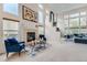 Bright living room with a fireplace, high ceilings, and large windows at 6598 S Telluride St, Aurora, CO 80016