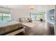 Spacious main bedroom with hardwood floors, windows, and a seating area at 6598 S Telluride St, Aurora, CO 80016