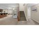 Basement staircase leading to a finished lower level with a bar and sitting area at 5320 S Race Ct, Greenwood Village, CO 80121