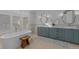 Luxurious bathroom with a freestanding tub and dual sinks at 5320 S Race Ct, Greenwood Village, CO 80121