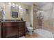 Basement bathroom with walk-in shower and granite vanity at 5320 S Race Ct, Greenwood Village, CO 80121