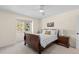 Bright bedroom featuring a wooden sleigh bed, and ample closet space at 5320 S Race Ct, Greenwood Village, CO 80121