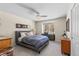 Spacious bedroom with a comfortable bed, built-in workspace, and large window at 5320 S Race Ct, Greenwood Village, CO 80121