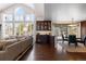Open dining area with built-in bar and hardwood floors at 5320 S Race Ct, Greenwood Village, CO 80121