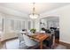 Elegant dining room with hardwood floors and a view of the living room at 5320 S Race Ct, Greenwood Village, CO 80121