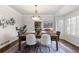 Elegant dining room featuring a large wooden table and chandelier at 5320 S Race Ct, Greenwood Village, CO 80121