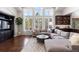 Spacious Gathering room with large windows, sectional sofa, and hardwood floors at 5320 S Race Ct, Greenwood Village, CO 80121