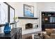 Fireplace with dark mantel and built-in cabinetry at 5320 S Race Ct, Greenwood Village, CO 80121