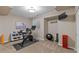 Basement home gym with exercise bike, weights, and yoga ball at 5320 S Race Ct, Greenwood Village, CO 80121