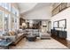 Bright living room with a sectional sofa and views of the backyard at 5320 S Race Ct, Greenwood Village, CO 80121
