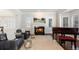 Bright living room with a fireplace and piano at 5320 S Race Ct, Greenwood Village, CO 80121