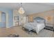 Large main bedroom with light blue walls and chandelier at 5320 S Race Ct, Greenwood Village, CO 80121