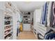 Bright walk-in closet with ample shelving and drawers at 5320 S Race Ct, Greenwood Village, CO 80121