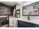 Modern bathroom featuring updated vanity, mirror, lighting and tiled walk-in shower at 5512 S Greenwood St, Littleton, CO 80120