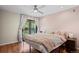 Main bedroom with light pink walls and a sliding door to a patio at 5512 S Greenwood St, Littleton, CO 80120