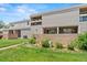 Two-story condo building with well-maintained lawns and landscaping and private patios at 5512 S Greenwood St, Littleton, CO 80120