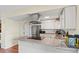 Kitchen island features granite countertops and modern black range at 5512 S Greenwood St, Littleton, CO 80120