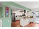 Open kitchen featuring white cabinetry and stainless steel appliances at 5512 S Greenwood St, Littleton, CO 80120