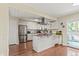 Bright kitchen with granite countertops, stainless appliances and island at 5512 S Greenwood St, Littleton, CO 80120