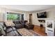 Comfortable living room features large sectional sofa and outdoor view at 5512 S Greenwood St, Littleton, CO 80120