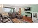 Inviting living room featuring a plush sectional sofa and a large window at 5512 S Greenwood St, Littleton, CO 80120