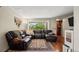 Cozy living room with sectional sofa and view to backyard at 5512 S Greenwood St, Littleton, CO 80120