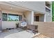 Inviting covered patio with comfortable hanging chair and a pleasant outdoor space at 5512 S Greenwood St, Littleton, CO 80120