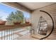 Relaxing patio area with porch swing and scenic views of the outdoors at 5512 S Greenwood St, Littleton, CO 80120
