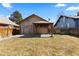 Backyard showcasing a pergola and a grassy yard at 3225 S Sherman St, Englewood, CO 80113