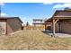 View of backyard and patio area with string lights and a shed in the background at 3225 S Sherman St, Englewood, CO 80113