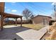 Backyard showcasing a paver patio, a pergola, and a detached garage at 3225 S Sherman St, Englewood, CO 80113