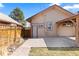 Backyard showcasing a paver patio, a pergola, and siding on the house at 3225 S Sherman St, Englewood, CO 80113