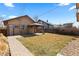 Backyard showcasing a pergola and a grassy yard at 3225 S Sherman St, Englewood, CO 80113