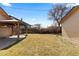 Backyard showcasing a pergola and a grassy yard at 3225 S Sherman St, Englewood, CO 80113