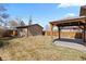 View of backyard and patio area with string lights and a shed in the background at 3225 S Sherman St, Englewood, CO 80113