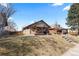 Exterior view of home with covered porch and steps to front door at 3225 S Sherman St, Englewood, CO 80113