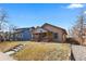 Exterior view of home with covered porch and grassy front yard at 3225 S Sherman St, Englewood, CO 80113