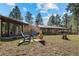 Backyard view with seating and a covered patio, perfect for enjoying the outdoors at 9107 S Deer Creek Canyon Rd, Littleton, CO 80127