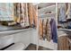 Organized walk-in closet featuring rods and shelves for optimal storage and organization at 9107 S Deer Creek Canyon Rd, Littleton, CO 80127