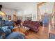 Bright and spacious living room showcasing hardwood floors, vaulted ceilings, and lots of natural light at 9107 S Deer Creek Canyon Rd, Littleton, CO 80127