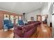 Cozy living room features vaulted ceilings, a hardwood floor and comfortable seating at 9107 S Deer Creek Canyon Rd, Littleton, CO 80127