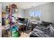Bedroom with a workspace area with a window view at 7468 S Alkire St # 205, Littleton, CO 80127