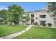 Well-maintained condo building with lush green lawn at 7468 S Alkire St # 205, Littleton, CO 80127