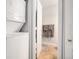 Convenient laundry room with stacked washer and dryer at 7468 S Alkire St # 205, Littleton, CO 80127