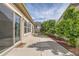 Serene outdoor patio area with lush landscaping and a tranquil ambiance for relaxation and outdoor enjoyment at 5495 Espana Ct, Denver, CO 80249