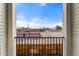 Balcony view overlooking a parking lot and neighborhood, providing a relaxing spot to unwind at 1524 Ingalls St, Lakewood, CO 80214