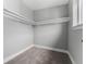 Walk-in closet featuring carpeted floors and shelving for storage at 1524 Ingalls St, Lakewood, CO 80214